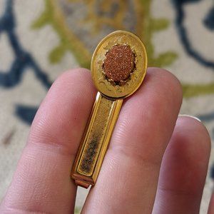 Vintage Goldstone & scroll tie or roach clip